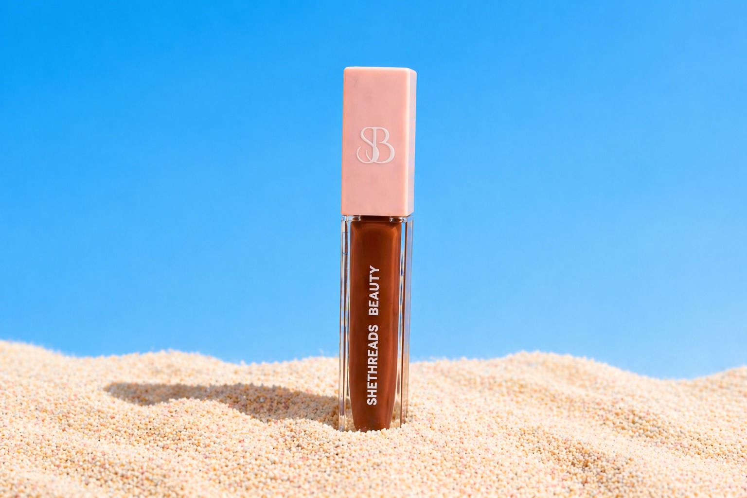 Shethreads Wealthy lip gloss on sand